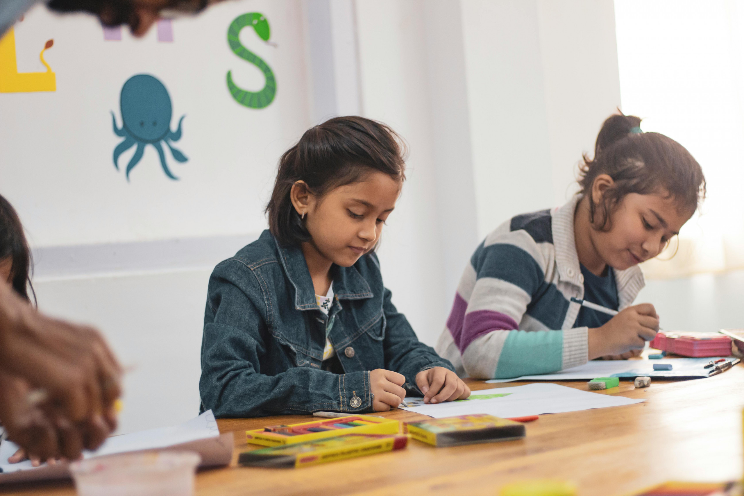 Students working on a colorful lesson
