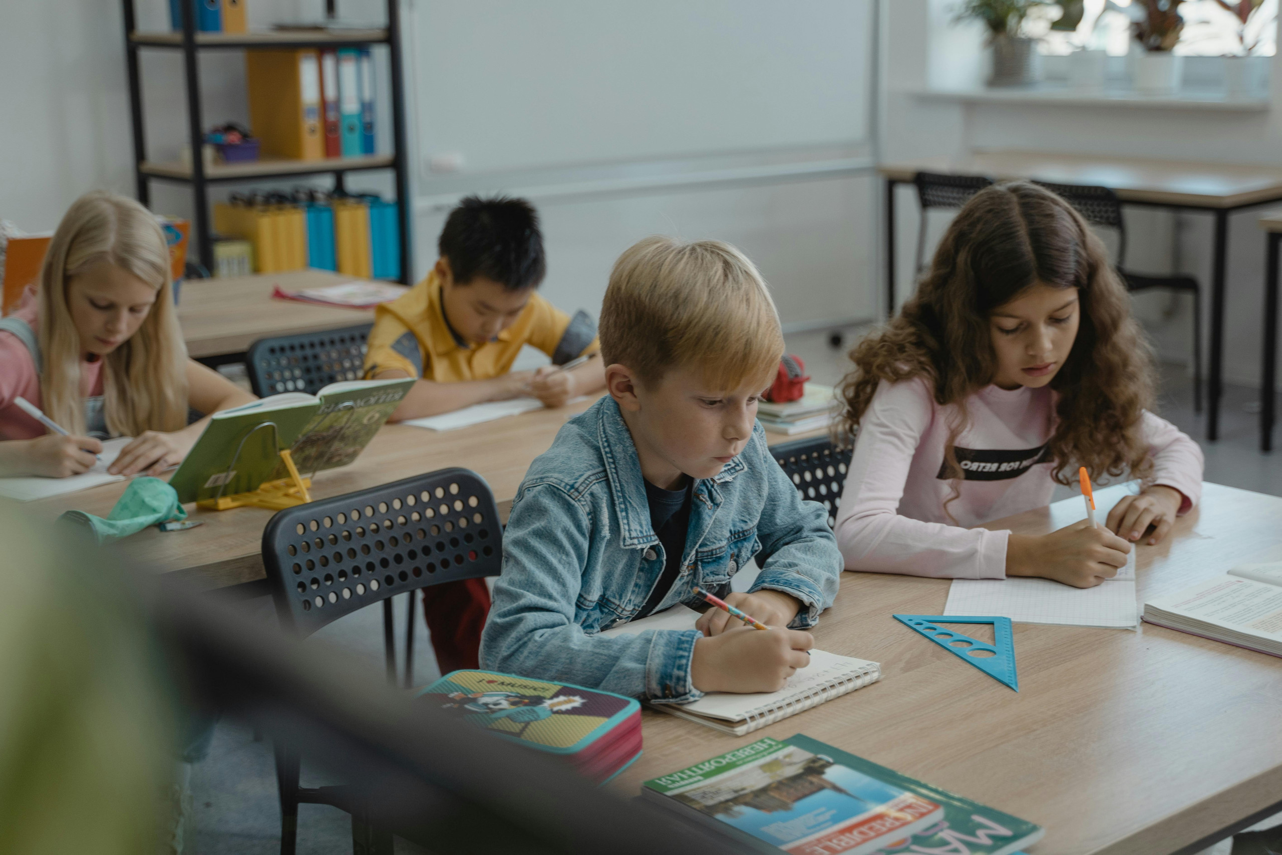 Students focused on writing at their desks